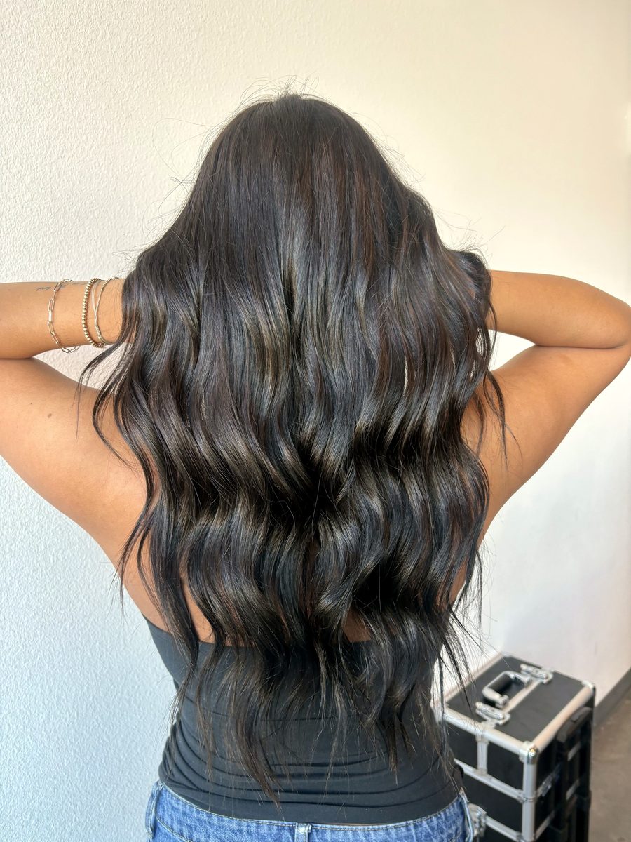 Long black waves, all-over color, styled loose by Leila Lee