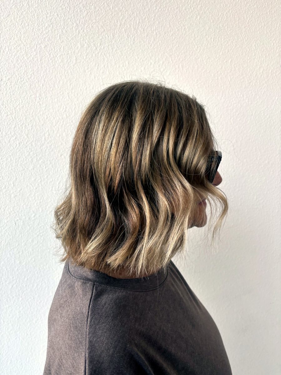 Blonde balayage bob with soft waves by Leila Lee